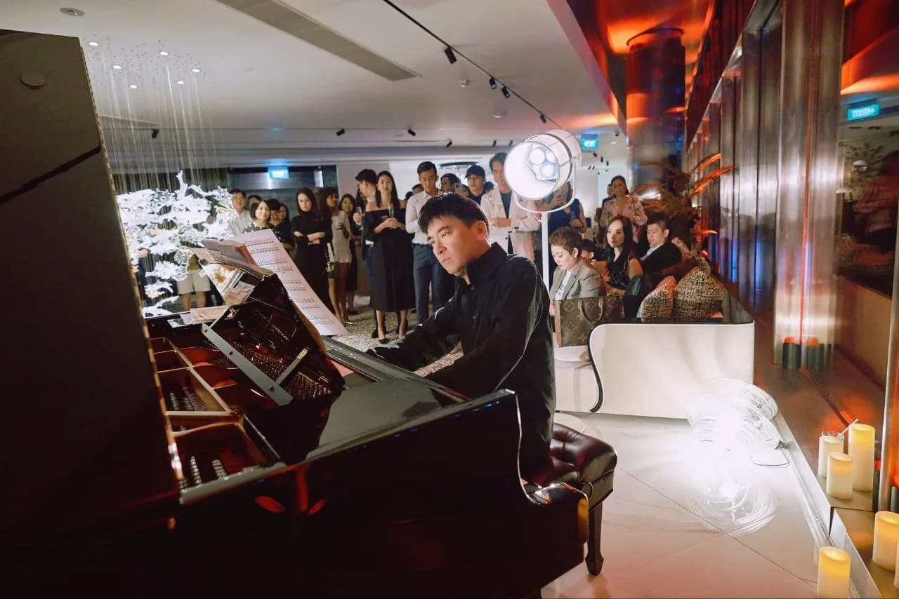 Salon recital with skyline backdrop